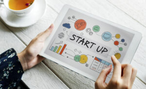 Person using tablet - What a new business website needs to succeed